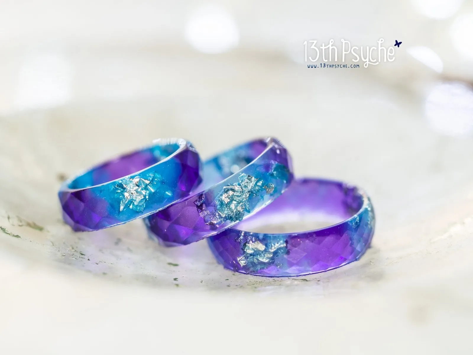 Purple and blue faceted resin ring with silver flakes