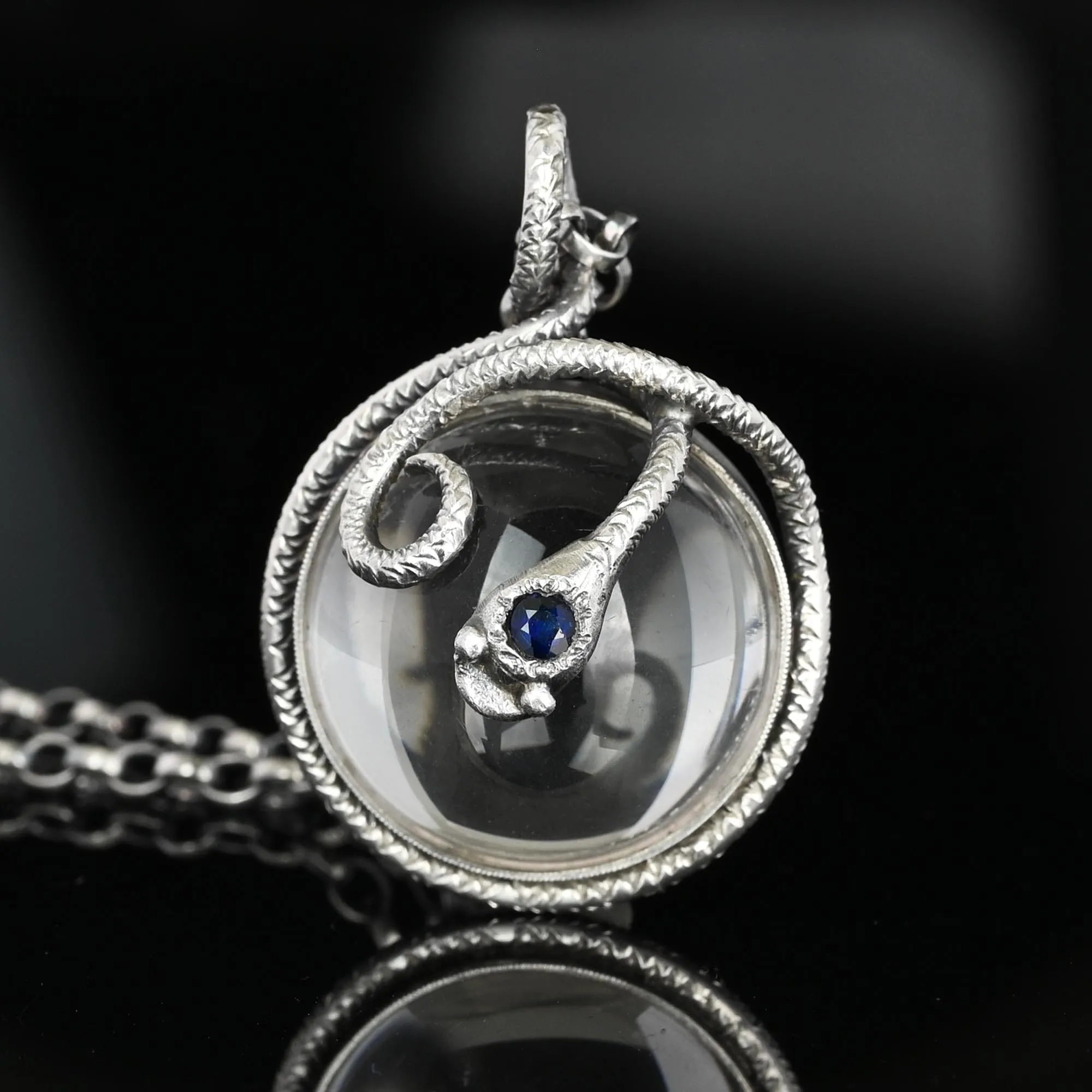 Silver Sapphire Pools of Light Rock Crystal Snake Necklace