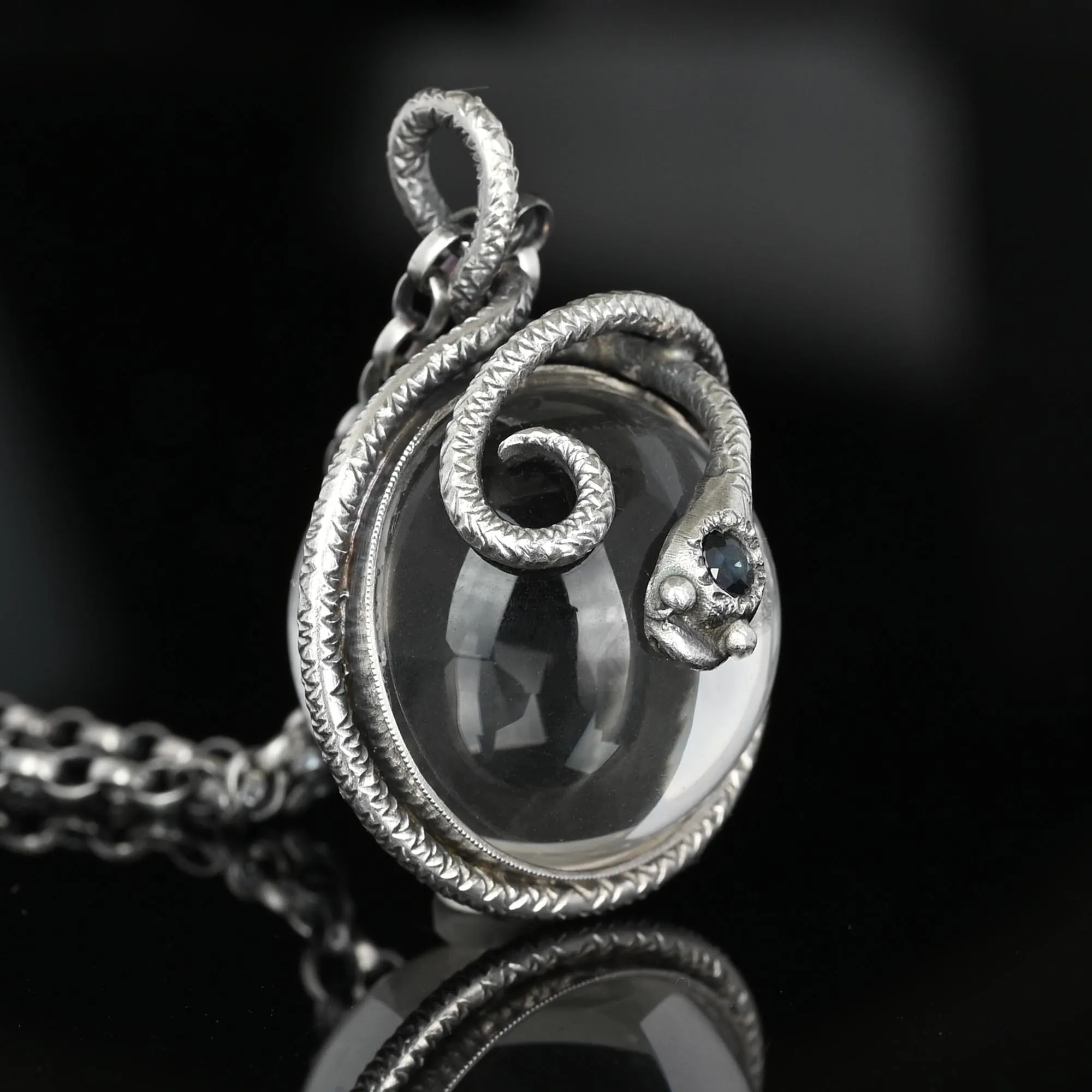 Silver Sapphire Pools of Light Rock Crystal Snake Necklace