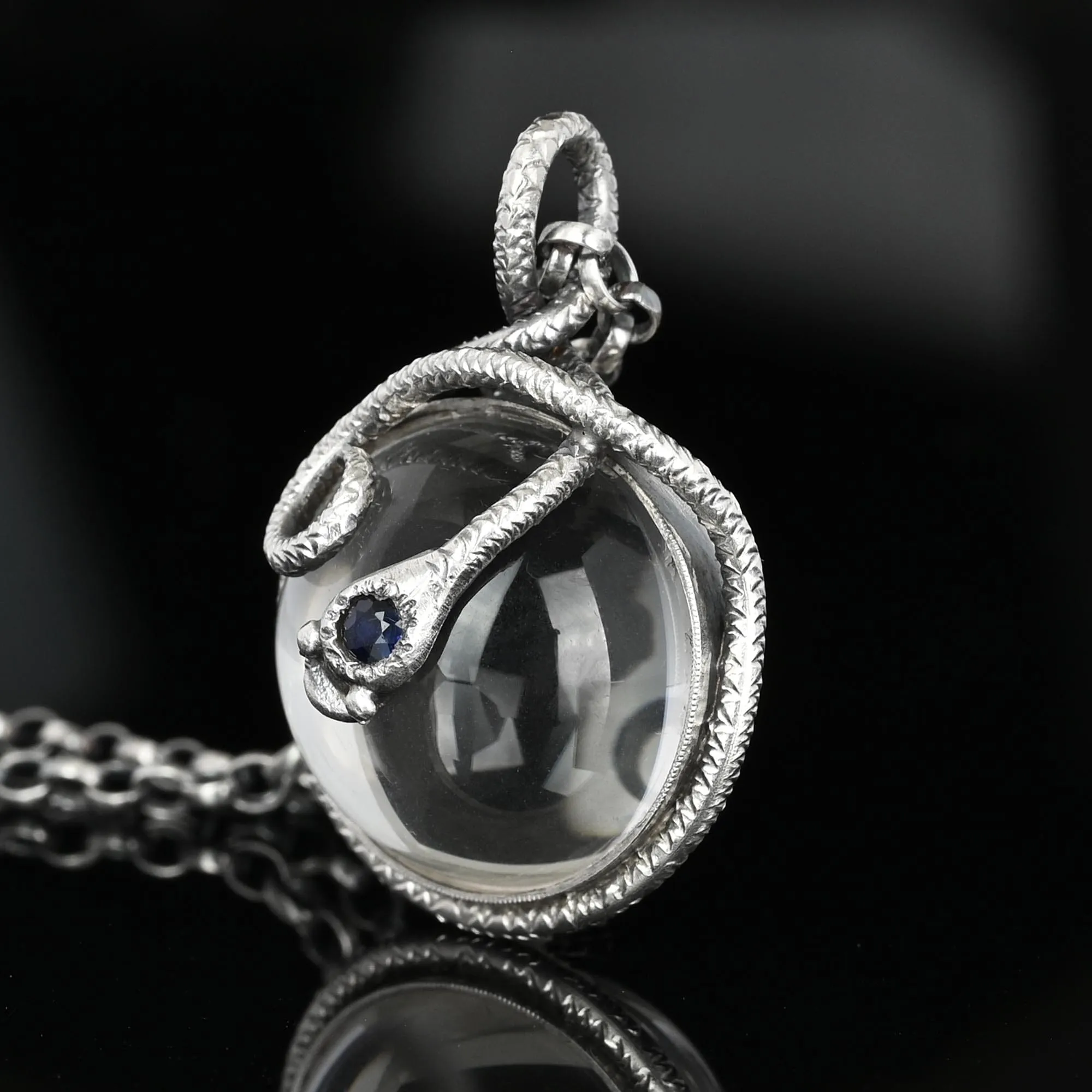 Silver Sapphire Pools of Light Rock Crystal Snake Necklace